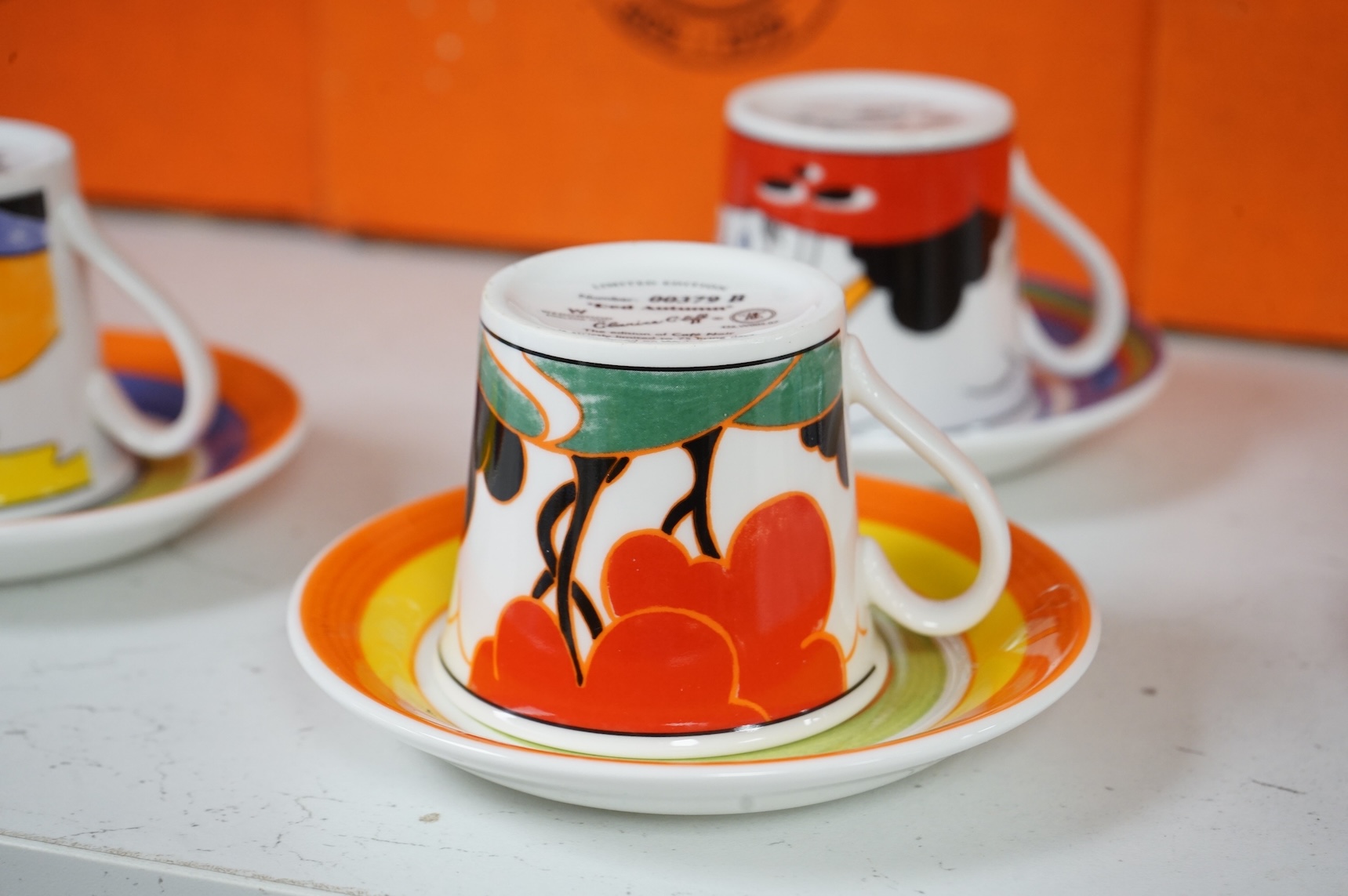 Four boxed limited edition Clarice Cliff cups and saucers to include Fantasque Mountain and Red Autumn, saucers 11.5cm in diameter